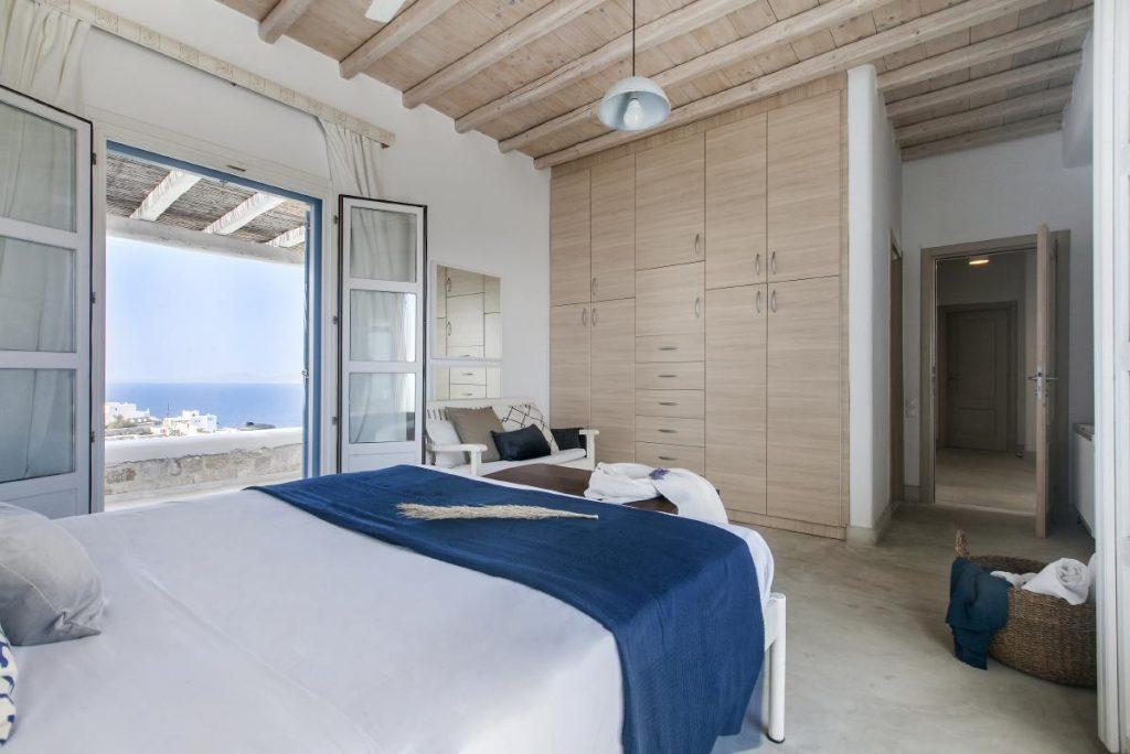 bedroom with balcony and stunning view