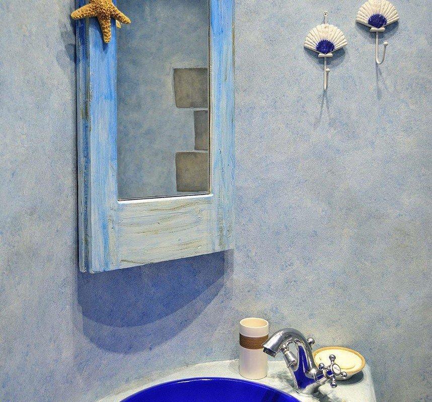 blue bathroom walls and matching mirror frame