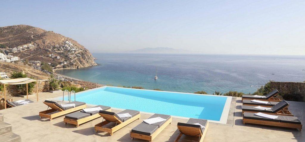 ideal place to sunbath and get perfect tan with your friends in next to pool easy chairs