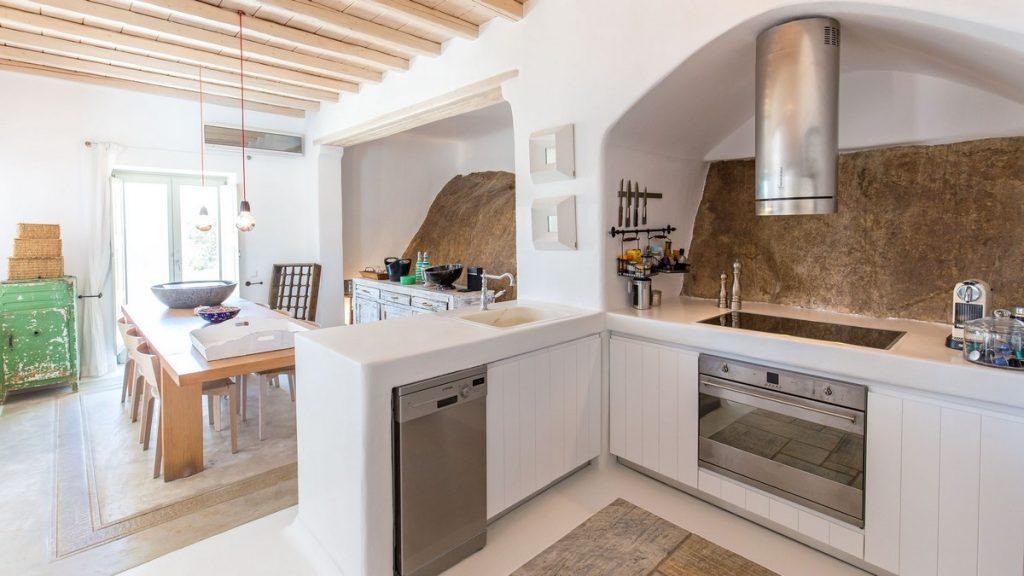kitchen with wooden white cabins and coffee maker