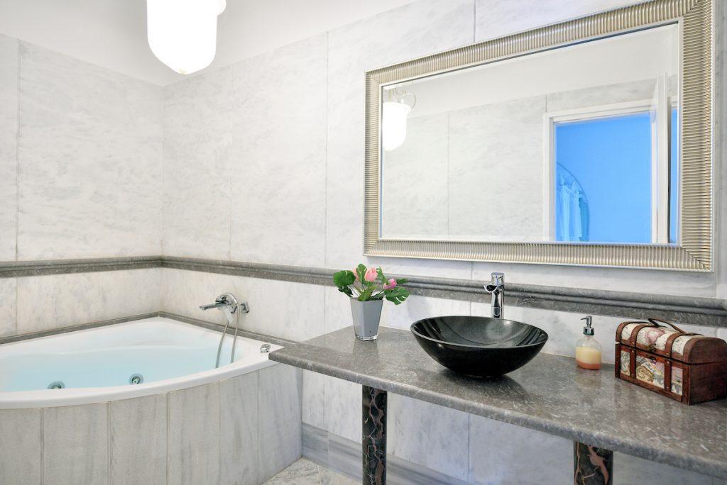 bathroom with huge mirror and for showering