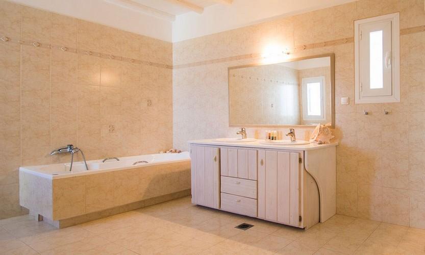 stylish bathroom equipped wide mirror big sink and bath tub