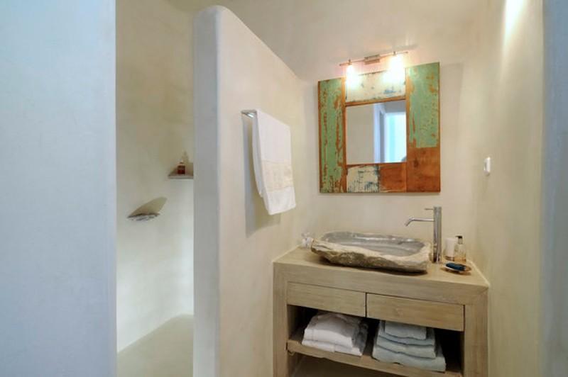 bathroom with elevated ceramic sink and towel rack