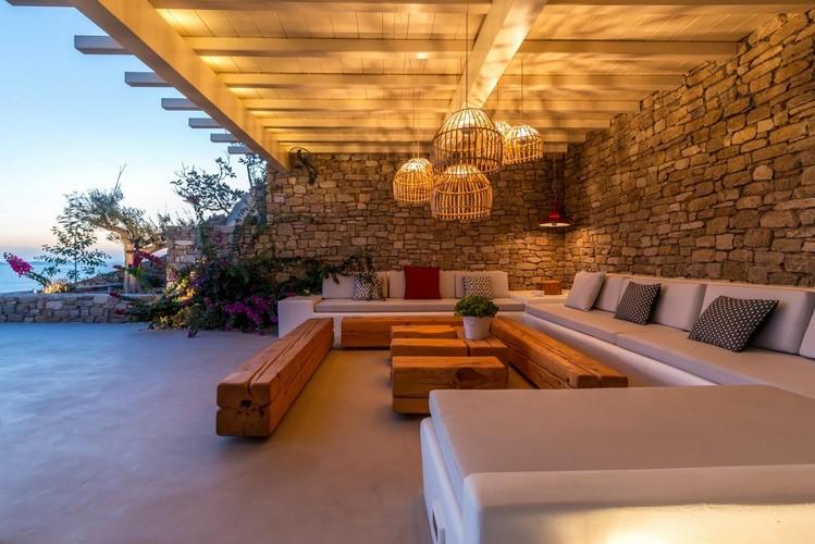 Villa_Ales_01.jpg Fanari Mykonos Outdoor Living area, bed, bench, table, lamp, sky, sea