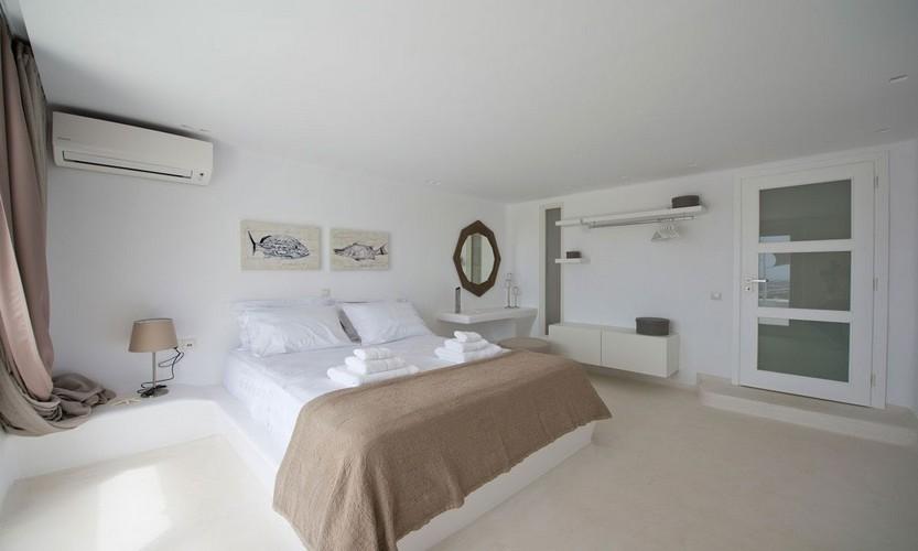 Villa_Antonia_08.jpg Tourlos Mykonos 2nd Bedroom, paint, bed, pillows, towels, door, shelf