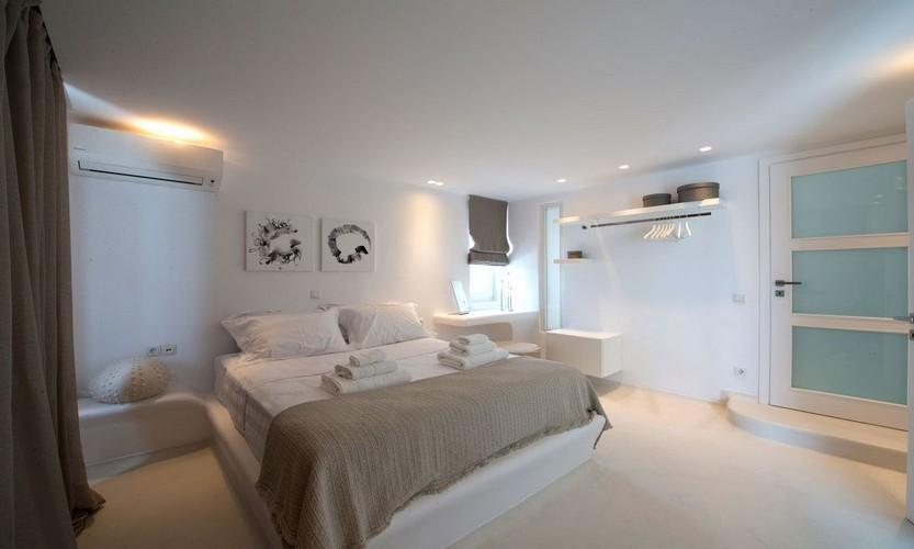 Villa_Antonia_09.jpg Tourlos Mykonos 1st Bedroom, double bed, pillows, air condition, door, stairs