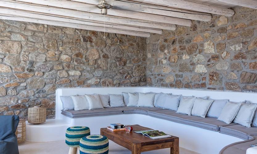 Villa_Apollo_20.jpg Choulakia Mykonos Outdoor Living area, bed, pillows, table, book, glass