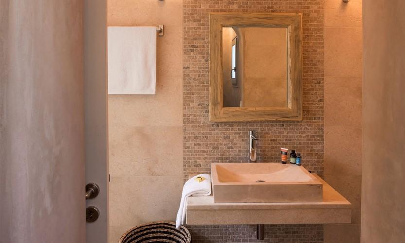 Villa_Apollo_35.jpg Choulakia Mykonos 1st Bathroom, washstand, mirror, soap, towel, towel rack