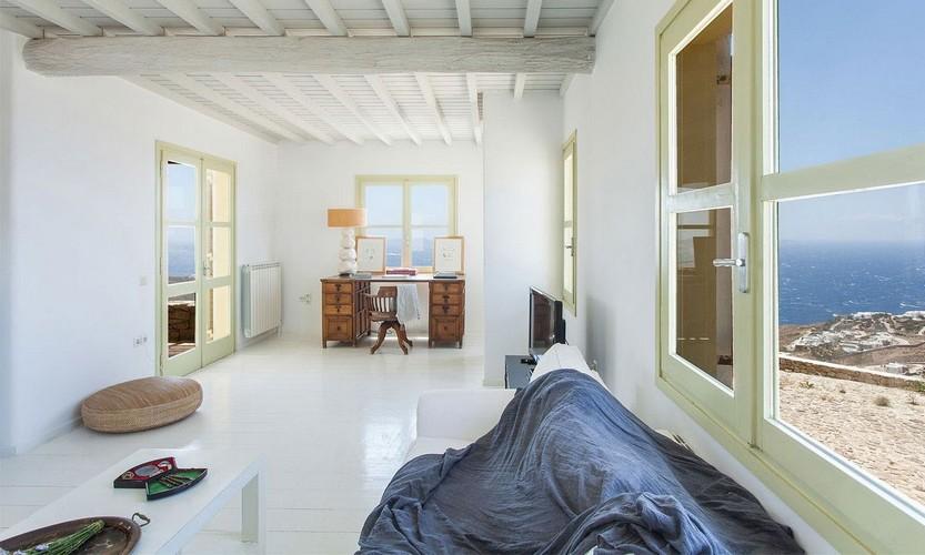 Villa_Cynthia_18.jpg Fanari Mykonos Living area, bed, pillows, table, chair