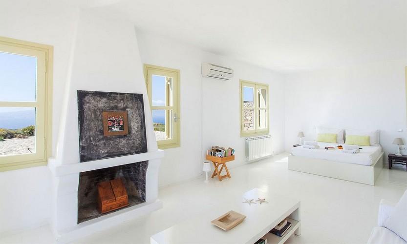Villa_Cynthia_29.jpg Fanari Mykonos Interior, bed, fire place, table, stars, book