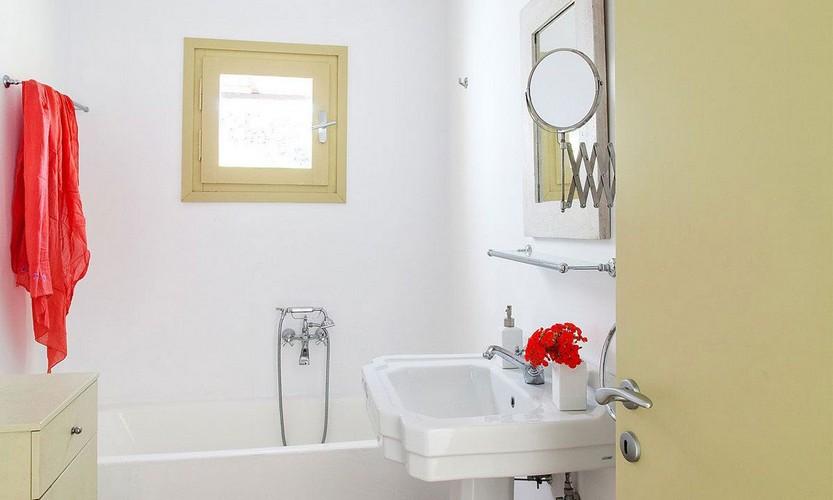 Villa_Cynthia_37.jpg Fanari Mykonos 3rd Bathroom, bath, washstand, mirror, towel, towel rack