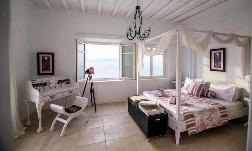Villa_Star1_14.jpg Kanalia Mykonos 1st Bedroom, curtains, bed, pillows, table, windows
