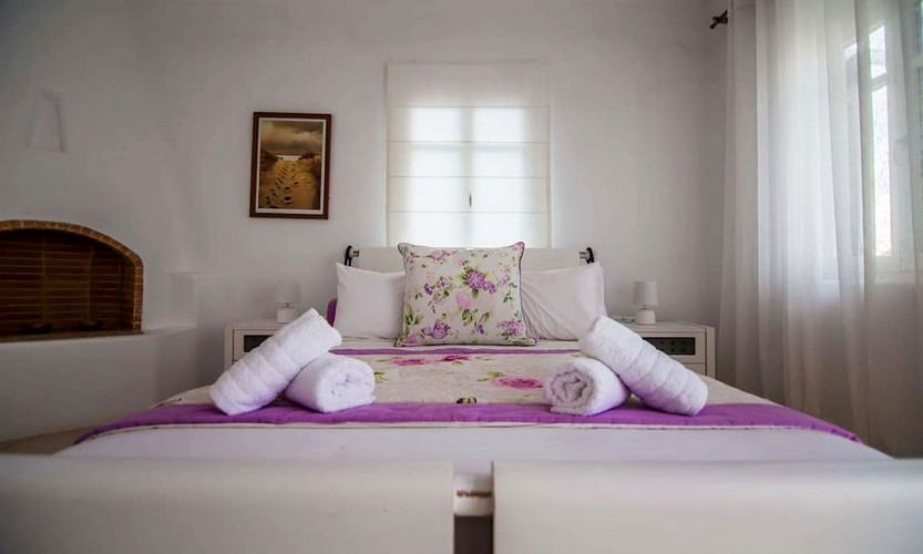 Villa_Star1_18.jpg Kanalia Mykonos 4th Bedroom, paint, bed, pillows, towels, fire place