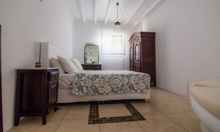 Villa_Star1_19.jpg Kanalia Mykonos 3rd Bedroom, cabinet, bed, pillows, mirror, lamp