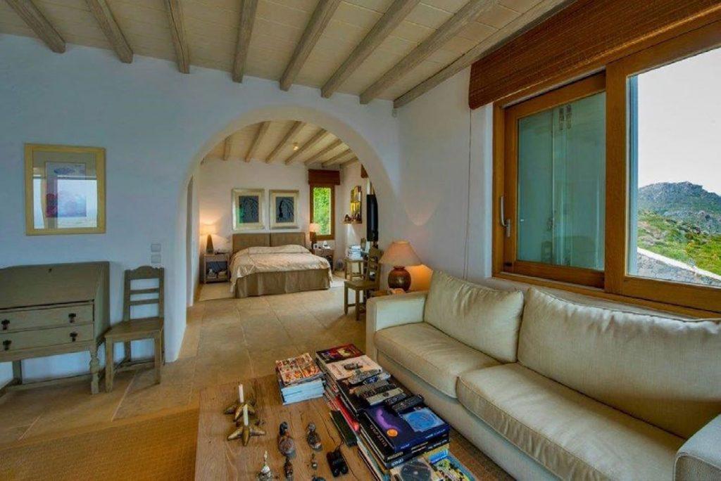 Villa Felicia Agios Lazaros Mykonos, living room, chair, sofa, pillows, books, TV remote