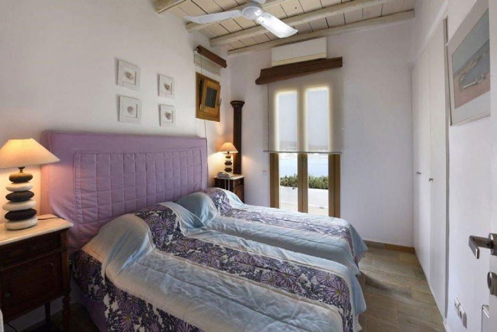 Villa Felicia Agios Lazaros Mykonos, 4th bedroom, double bed, paintings, pictures, lamps, nightstands