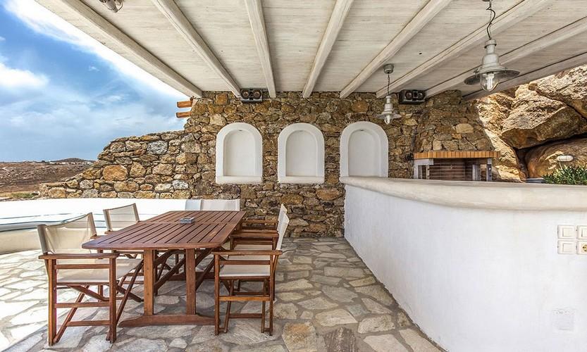 Villa_Zephyr2_12.jpg Super Paradise Mykonos Outdoor Dining area, table, chairs, bar, lamp, sky