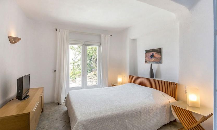 Villa_Zephyr2_18.jpg Super Paradise Mykonos 1st Bedroom, double bed, pillows, paint, lamp, night table