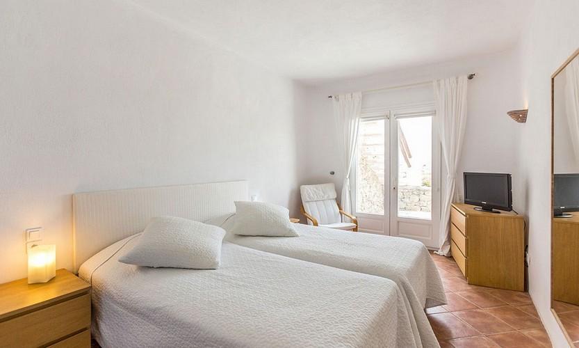Villa_Zephyr2_21.jpg Super Paradise Mykonos 2nd Bedroom, bed, flat screen tv, lamp, mirror, curtains