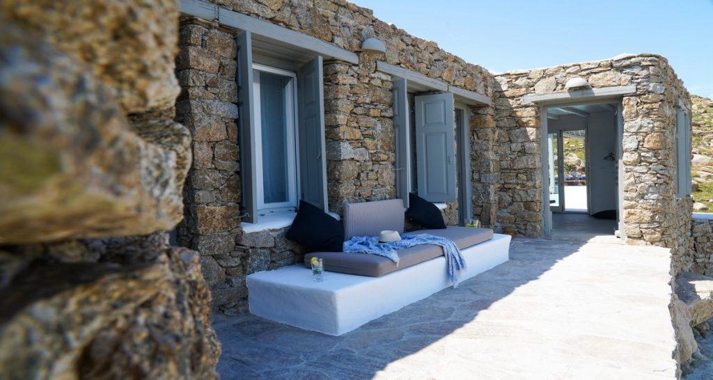 stone wall villa with bench for relax and enjoy in view