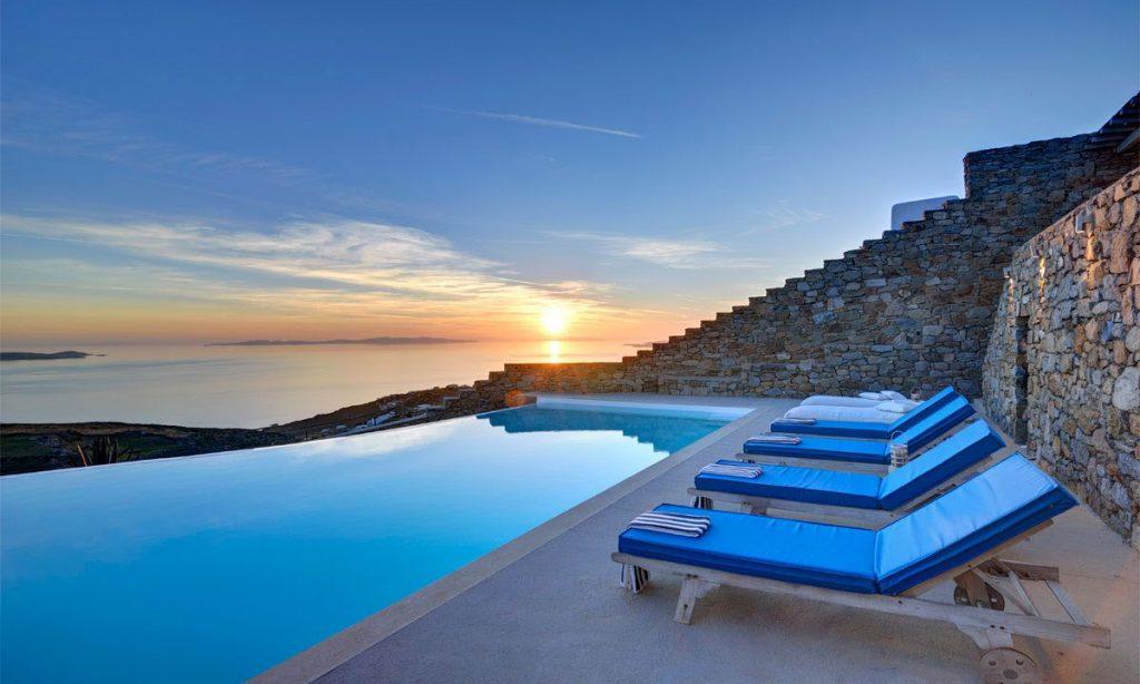 Villa Gianna, Fanari, Mykonos, Pool, Sky, White villa, Sunbeds, Stone wall, Plants, Sunset, Sea view, Sea, Towels