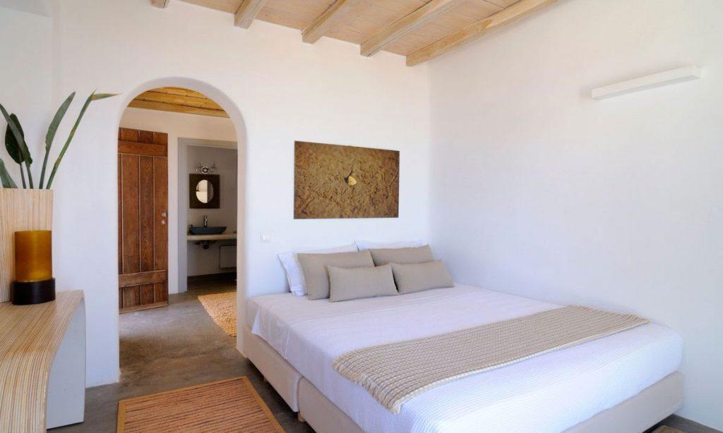Villa Gianna, Fanari, Mykonos, Master bed, Picture, Mirror, Pillows, Plants, Candels