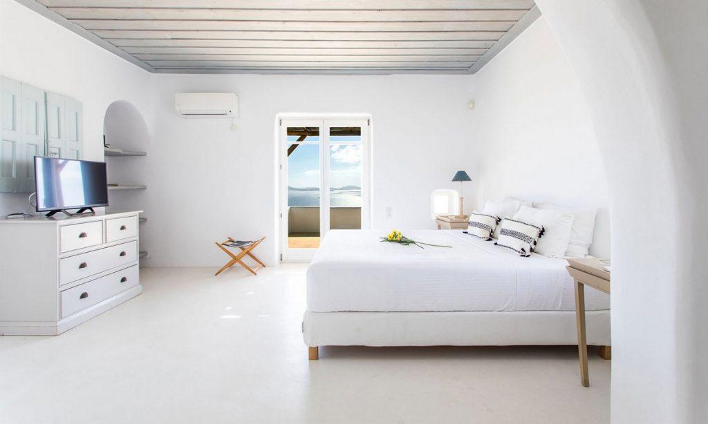 modern designed white wall bedroom with direct exit to balcony