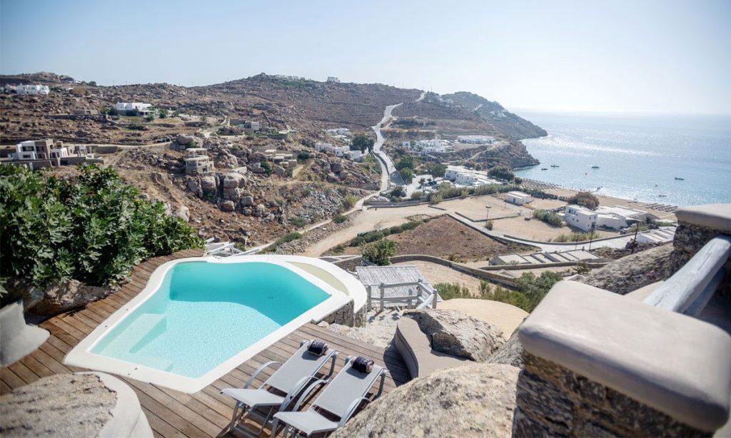 Villa Ida, Super Paradise, Mykonos, Pool, Swimming pool, Candels, Stone, Rocks, Plant, Sea, Sea view, Sky, Stairs, Sunbeds