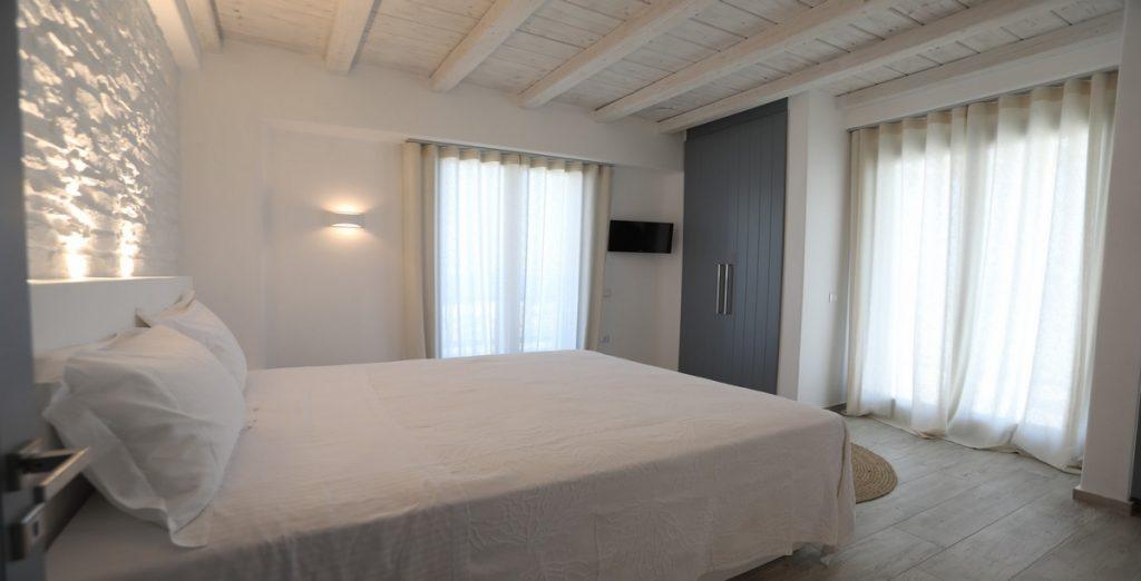 Villa-Ragnar_19.jpg Kalafatis Mykonos, 3rd bedroom, king size bed, closet, flat screen TV, curtains