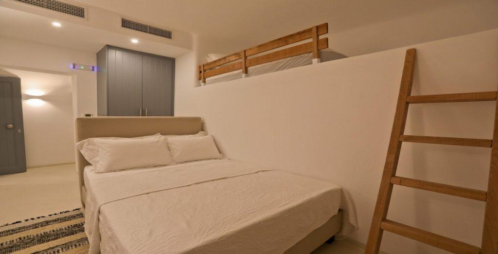 Villa-Ragnar_25.jpg Kalafatis Mykonos, 4th bedroom, bed, closet, pillows, carpet