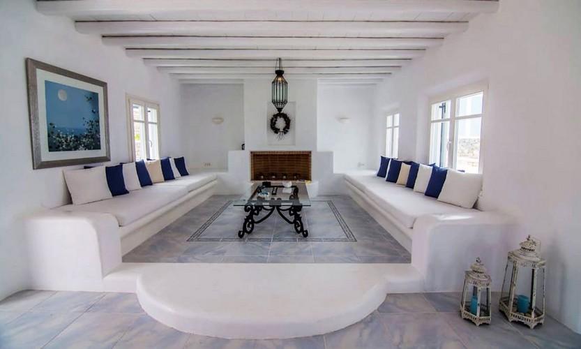 Villa_Eli_16.jpg Agios Ioannis Mykonos Living area, bench, pillows, fireplace, paint