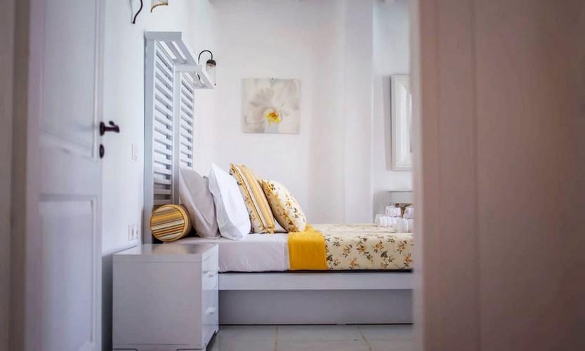 Villa_Eli_23.jpg Agios Ioannis Mykonos 4th Bedroom, bed, night table, lamp, door