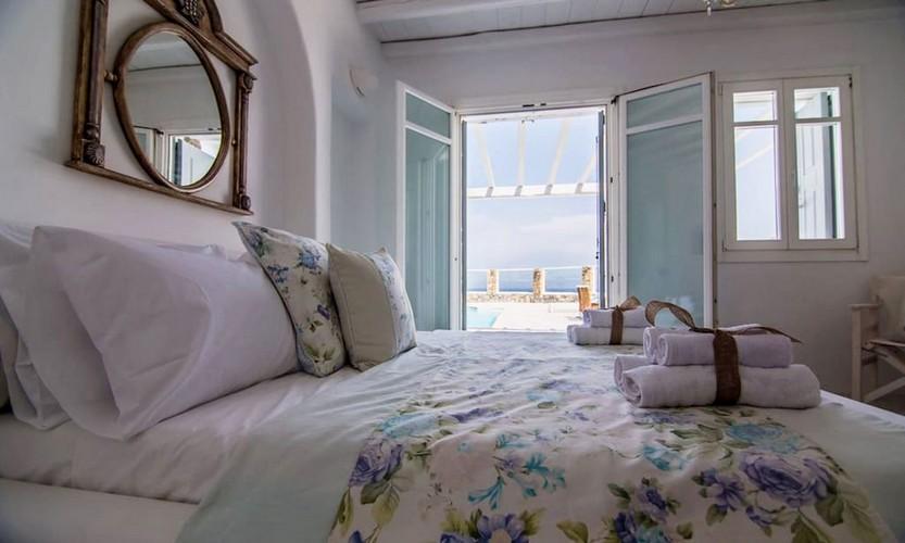 Villa_Eli_25.jpg Agios Ioannis Mykonos 2nd Bedroom, bed, pillows, towels, mirror, door