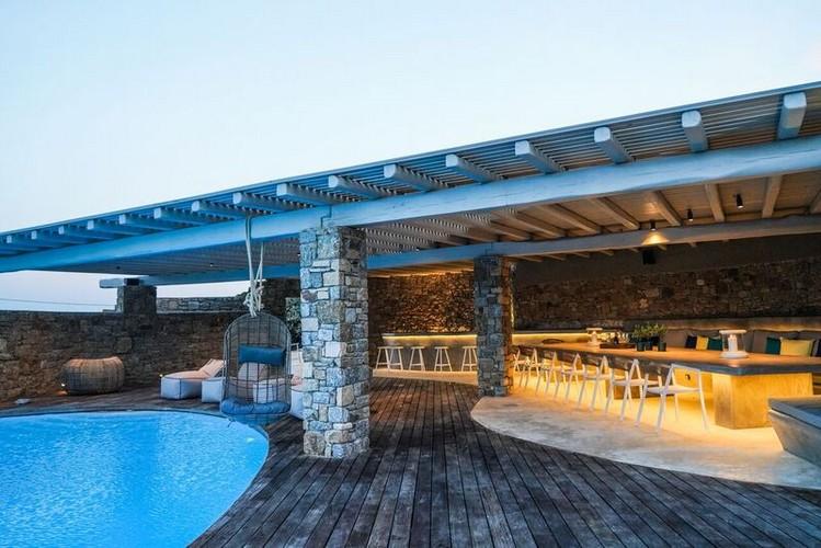 outdoor area with illuminated dining area and huge table