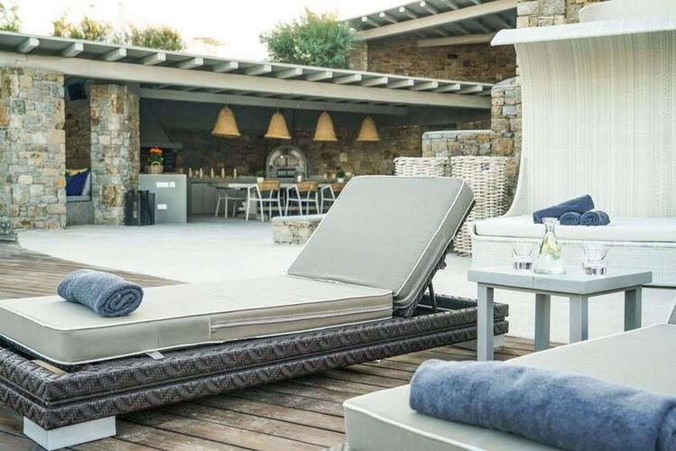 outdoor area with comfort climbers and soft towels and table with water