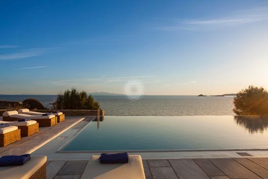 Villa_Jolly_14.jpg Agios Lazaros Mykonos Outdoor, pool, tree, climbers, towels, sky