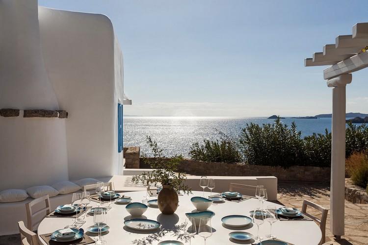 Villa_Jolly_20.jpg Agios Lazaros Mykonos Outdoor Dining area, table, plate, glass, chairs, villa, sea, sky, horizon, island