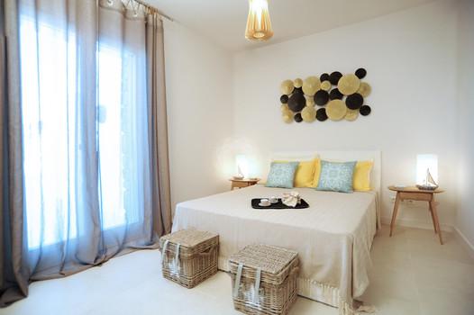 Villa_Lenard_04.jpg Panormos Mykonos 2nd Bedroom, double bed, pillows, night table, lamp, curtains
