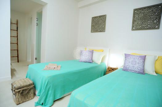 Villa_Lenard_08.jpg Panormos Mykonos 1st Bedroom, bed, pillows, door, night table