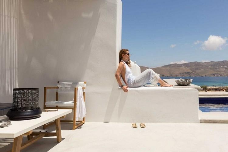 Woman relaxing in her villa in Panormos