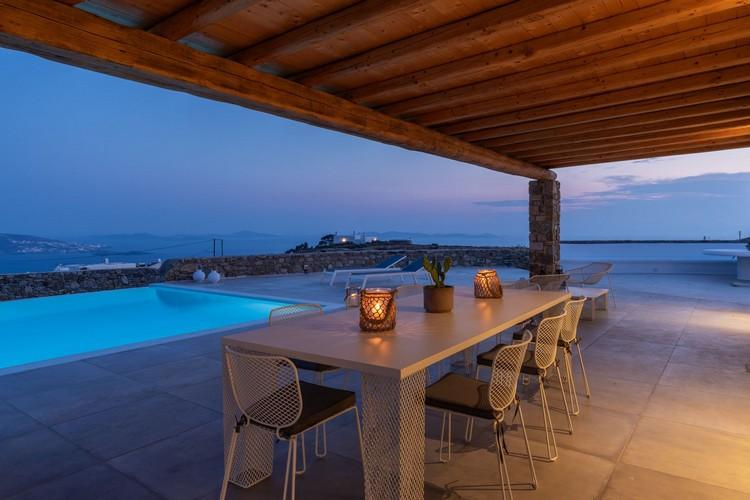 Villa_Madona_13.jpg Tourlos Mykonos Outdoor Dining area, table, chairs, candle, pool