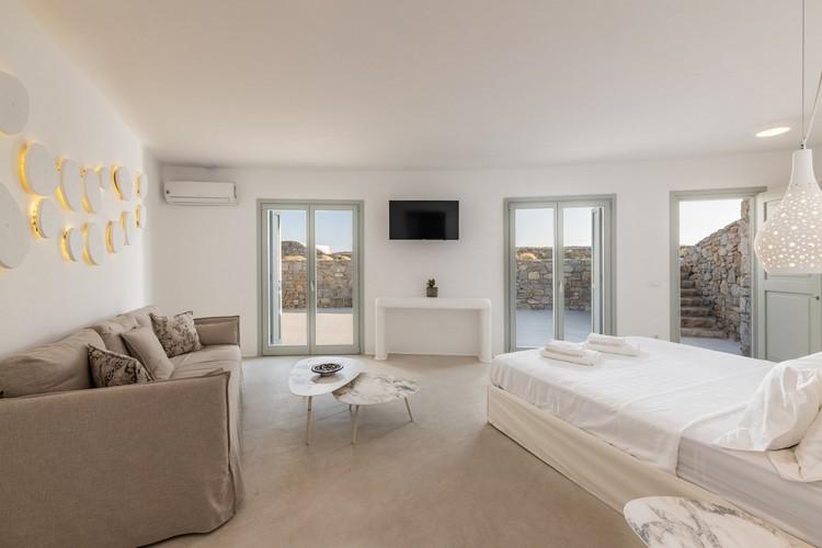 Villa_Madona_20.jpg Tourlos Mykonos 3rd Bedroom, flat screen tv, double bed, pillows, towels, table