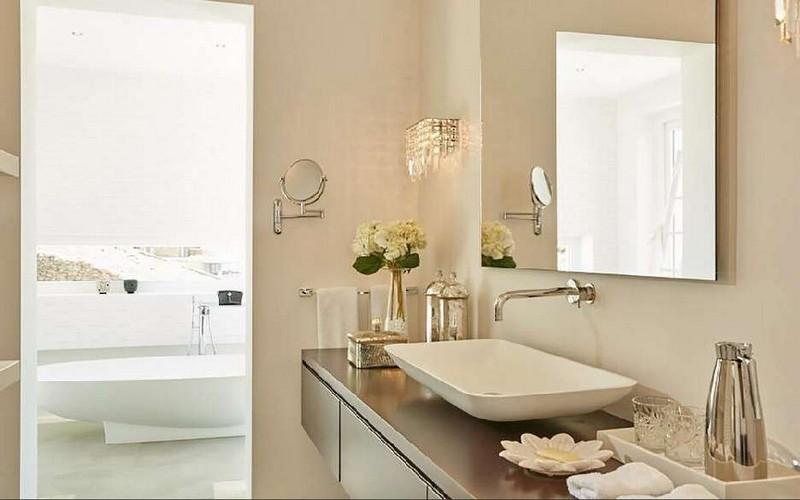 Villa_Nadine_18.jpg Houlakia Mykonos 3rd Bathroom, washstand, mirror, flowers, bath