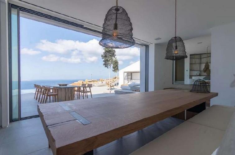 Villa_Nerina_05.jpg Tourlos Mykonos Dining area, lamp, table, bed, chairs