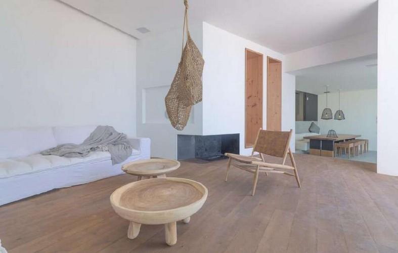 Villa_Nerina_07.jpg Tourlos Mykonos Living area, lamp, table, chairs, bed