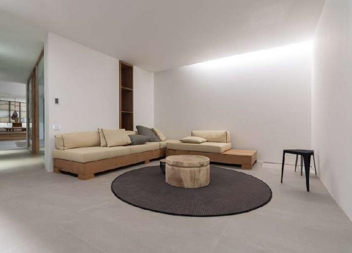 Villa_Nerina_11.jpg Tourlos Mykonos Living area, bed, carpet, table, pillows, shelf