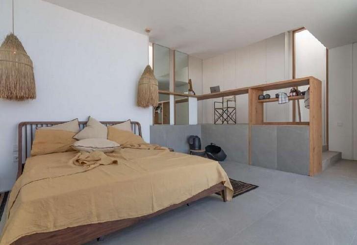 Villa_Nerina_12.jpg Tourlos Mykonos 3rd Bedroom, bed, stairs, pillows, lamp, laptop, chair