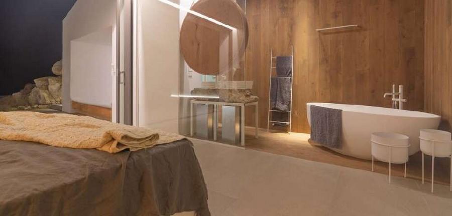Villa_Nerina_17.jpg Tourlos Mykonos 3rd Bathroom, bed, mirror, bath, towel rack, towels