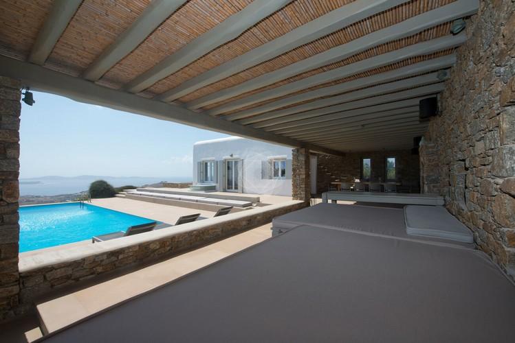 Villa_Ophelia_10.jpg Agios Lazaros Mykonos Outdoor Living area, bed, pillows, speaker, climbers, pool, villa