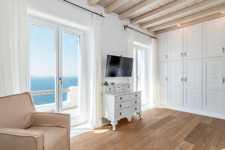 Villa_Pamella_11.jpg Poulia Mykonos Interior, flat screen tv, chair, cabinet
